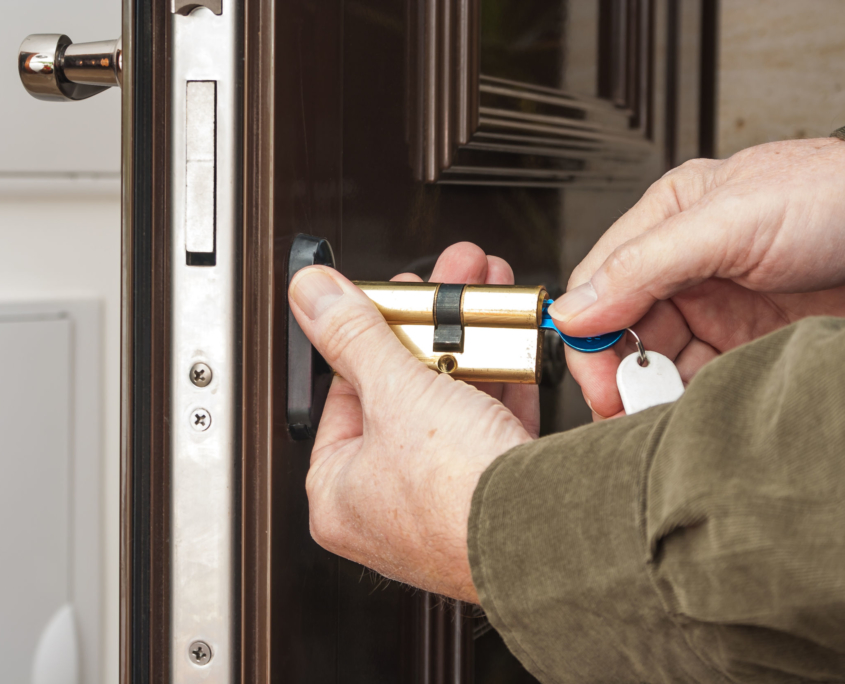 59744301 - locksmith replacing a cylinder lock